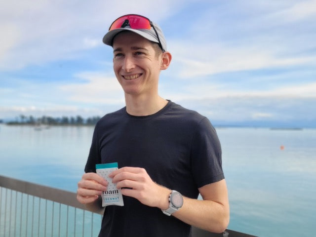 Tom Somerville Holding a Packet of Roam Nut Butter